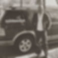 Photo of chiropractor standing in front of their mobile chiropractic vehicle.
