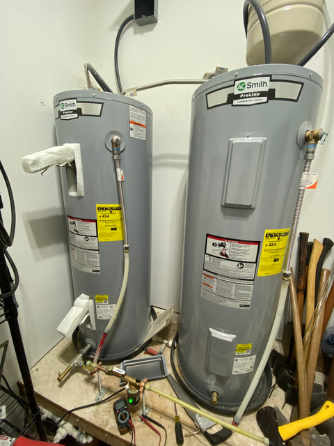 Two AO Smith ProLine commercial water heaters installed side by side
