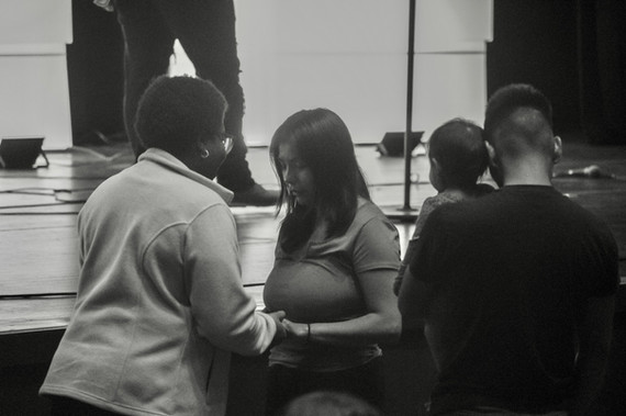 pastor praying with church member during personal ministry moment