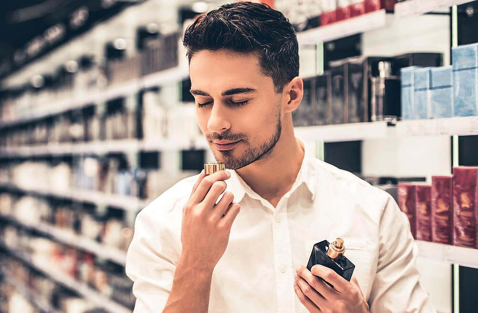 Man smelling perfume