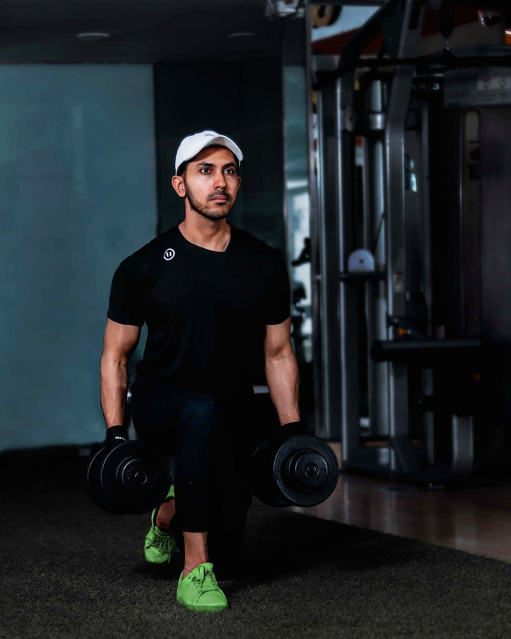 Man doing lunges in gym