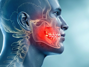 Image of man with xray showing red area over TMJ region indicating pain