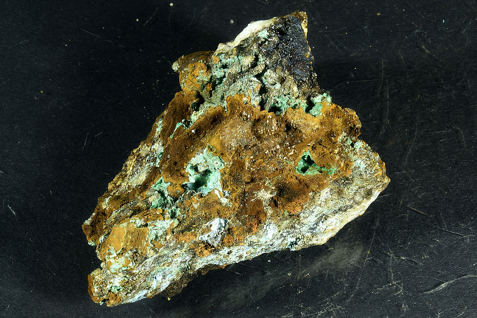 Malachite crystals in rock matrix