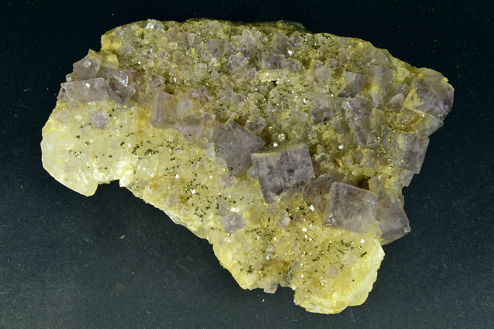 Purple cubic Fluorite crystals on Quartz