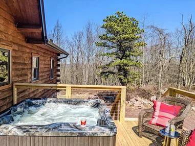 Skypine Lodge hot tub deck pine tree soak relaxation