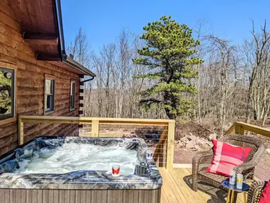 Skypine Lodge hot tub deck pine tree soak relaxation