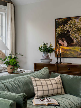 Moody primary bedroom full of texture and layered accents.