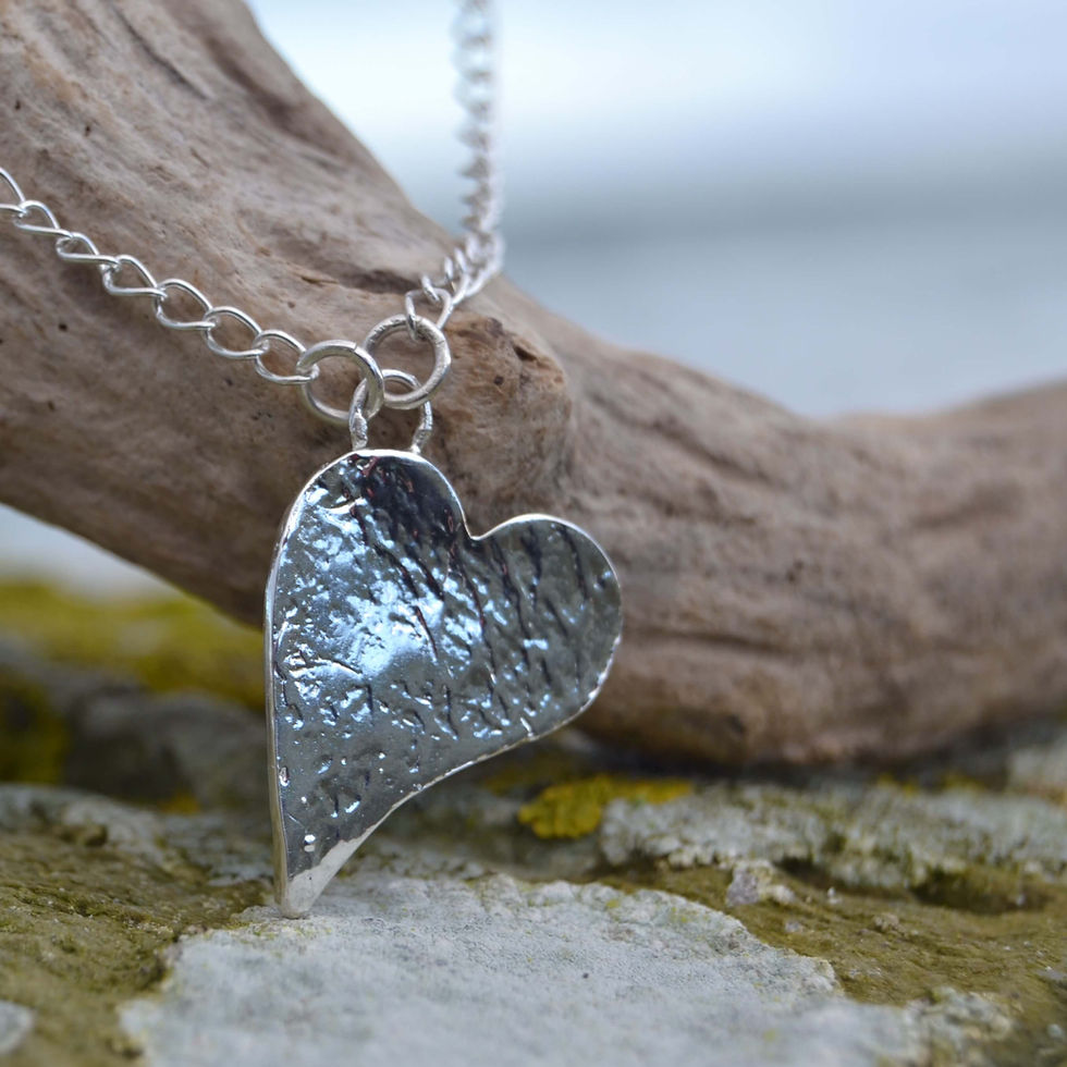 Thumbnail: handmade recycled silver heart necklace with bubble texture by KL jewellery designs.