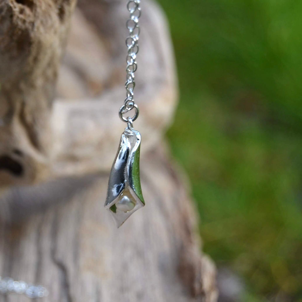 Thumbnail: Handmade silver Lily pendant made from recycled silver, with ivory freshwater pearl
