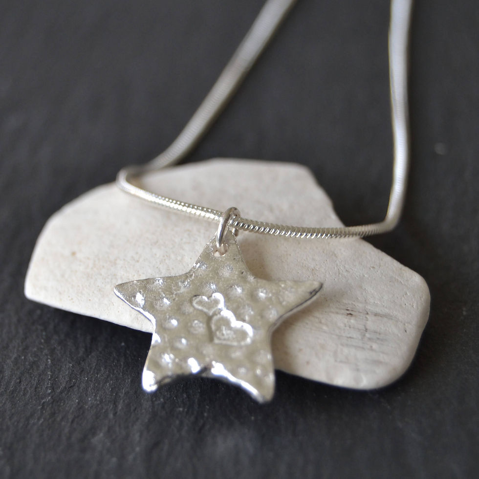 Thumbnail: Memorial ashes in silver star pendant by KL jewellery designs