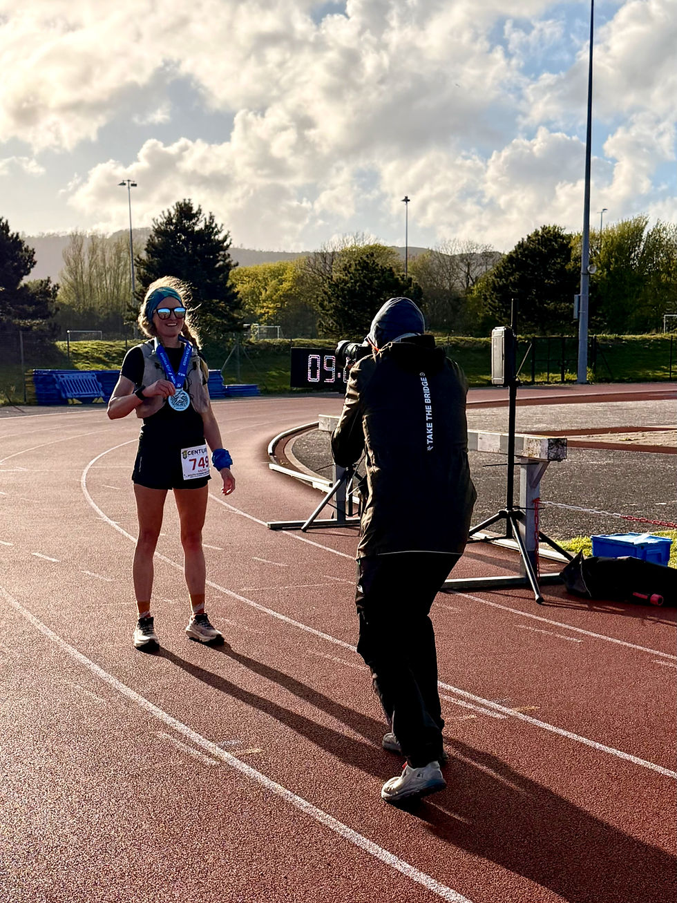 Rachel Murphy completing Centurion Running South Downs Way 50 Finish line