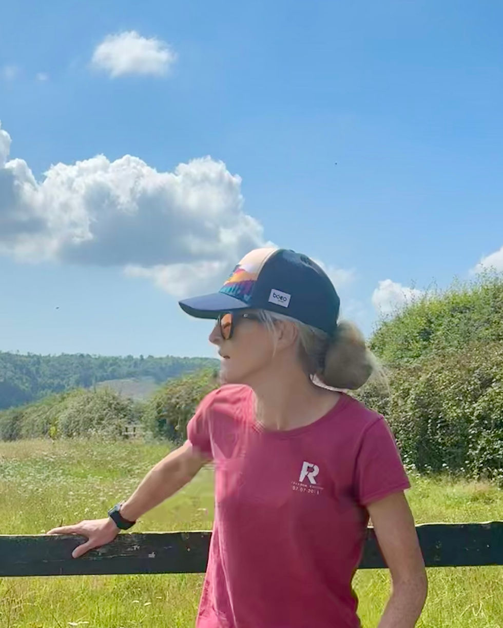 woman in trucker cap