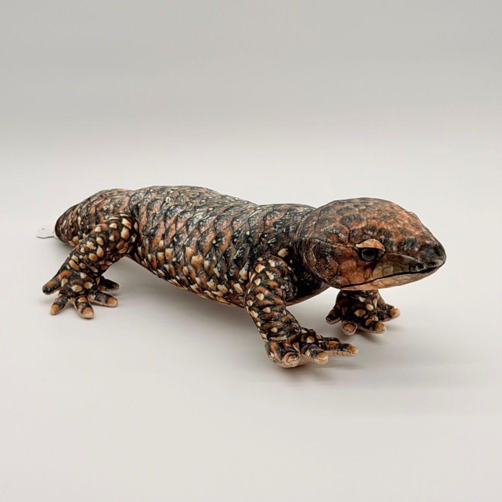 Front view Huggable Toys 48cm Bobtail Lizard plush toy features soft dark scaly patterned fabric, stubby tail and black eyes