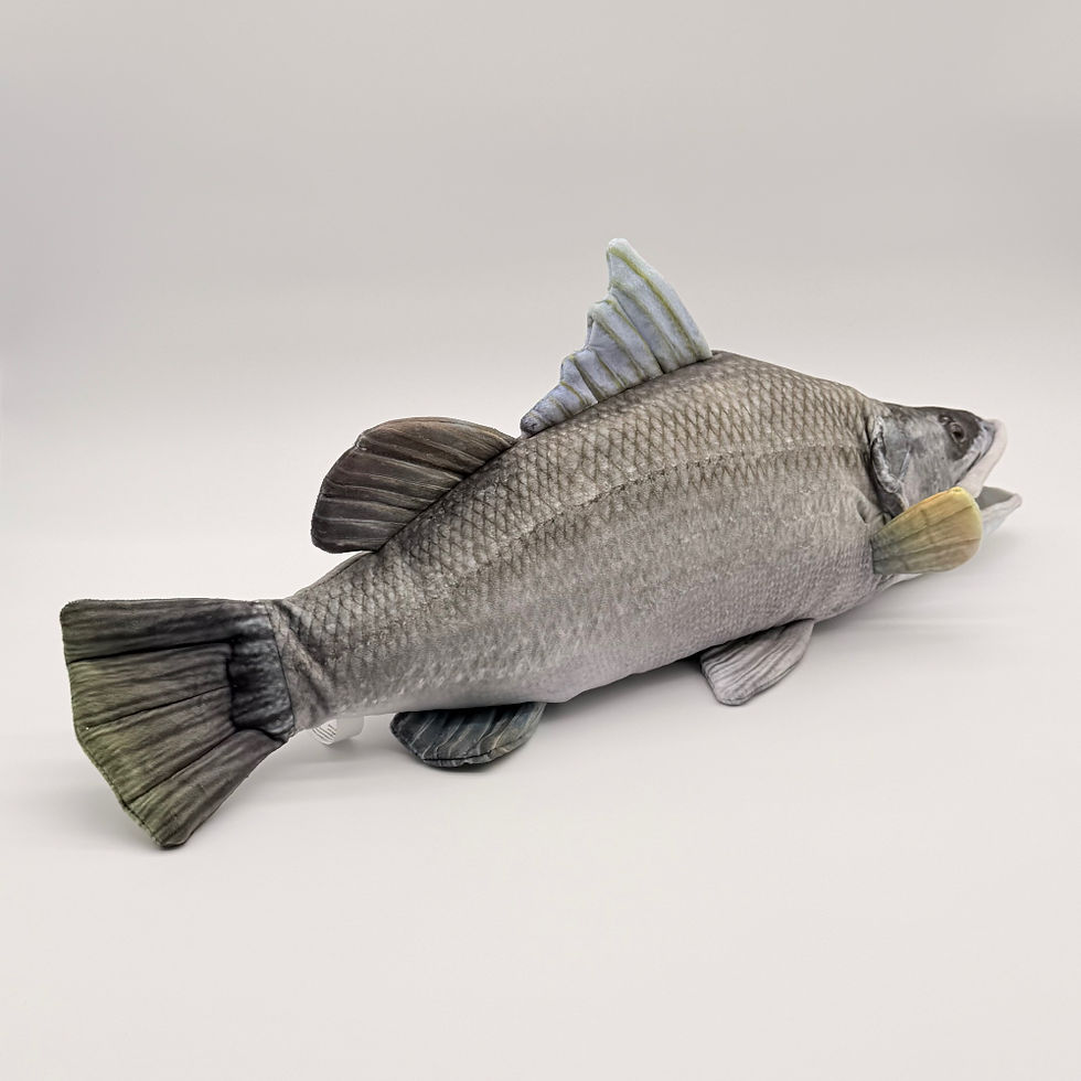 Back view Huggable Toys 60cm Barramundi plush toy features soft blue gray, black mottled fabric with fins, tail and big eyes