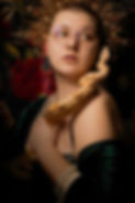 Sarah Henry of Still Poetry Photography posing with a snake for a boudoir photo
