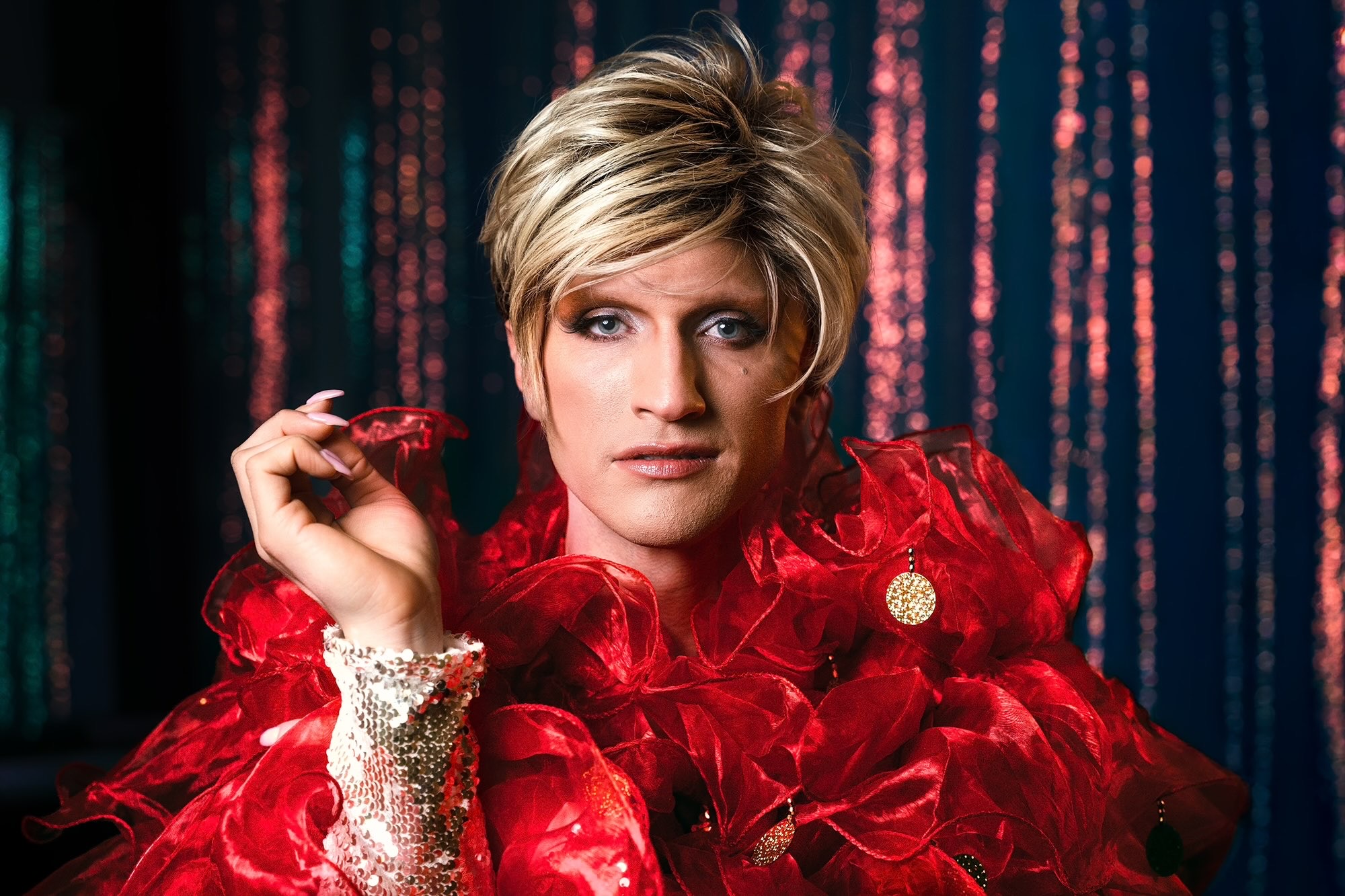 Trans voice teacher and drag performer exploring gender, voice, and performance
