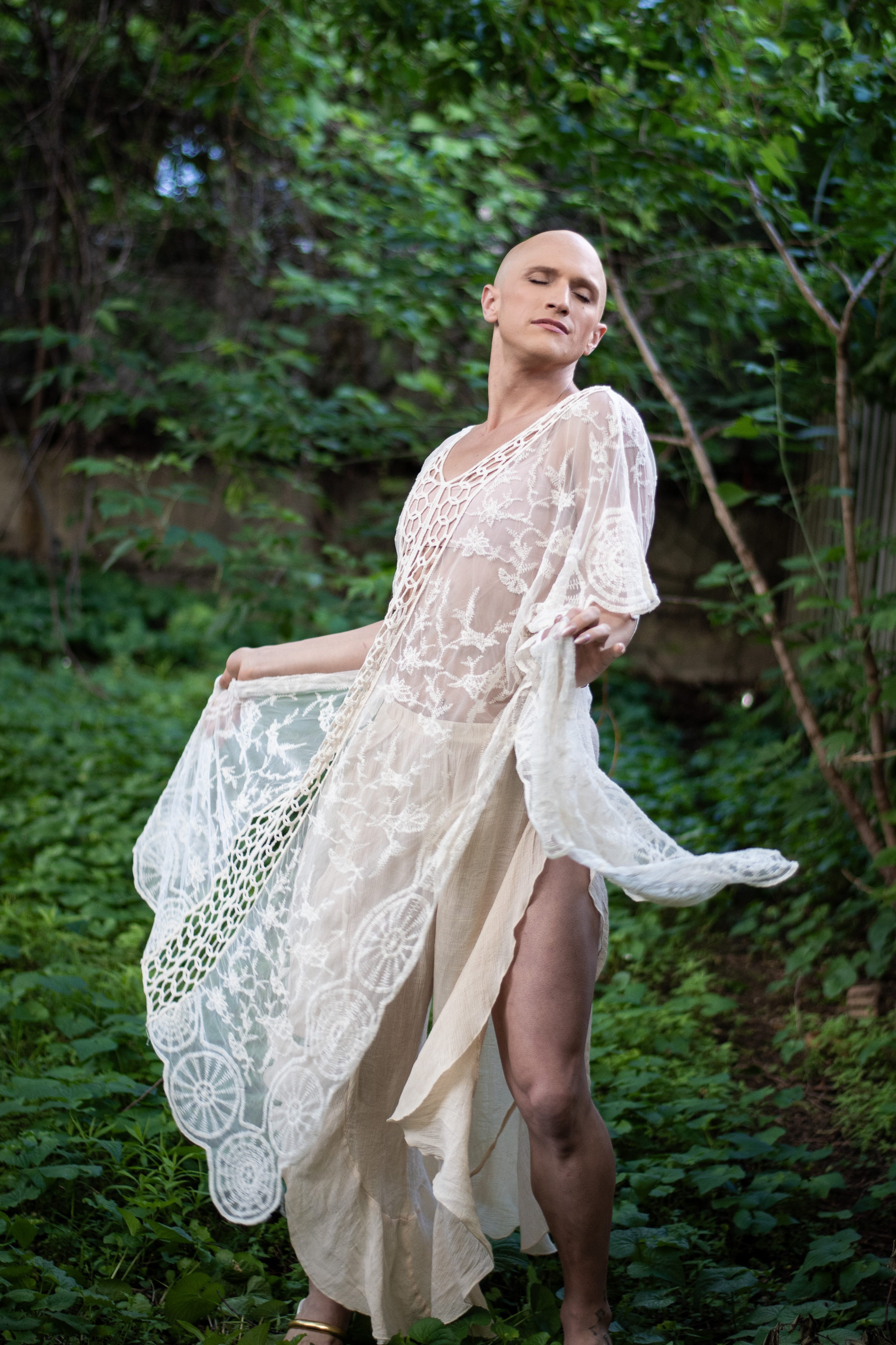 Oceana Dix twirling in a flowing dress in a garden