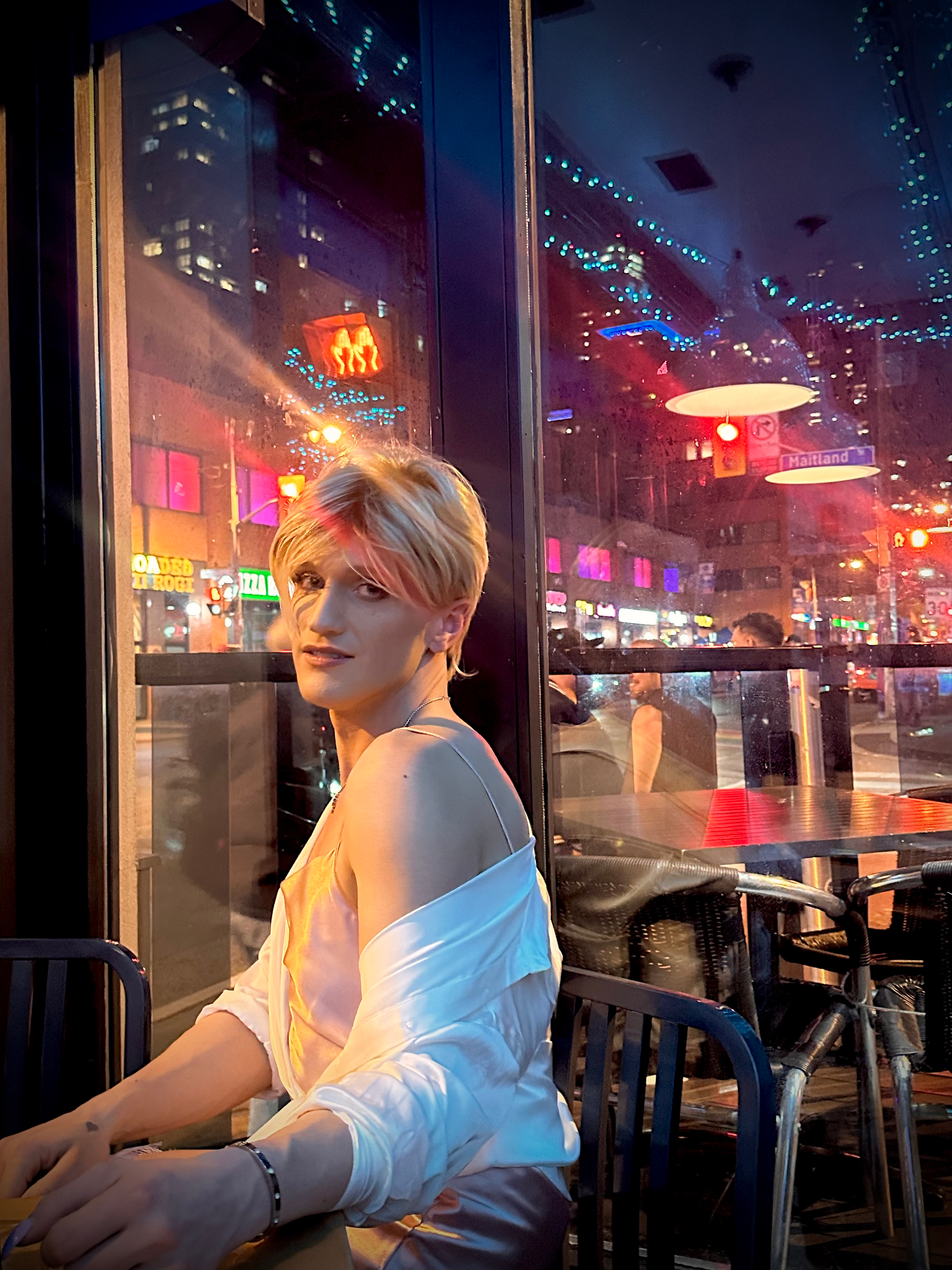 Oceana Dix seated by a window at night
