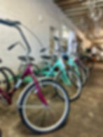 Image of a row of tricycles at the shop.