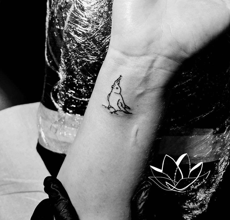 Small parrot custom tattoo by Mandira