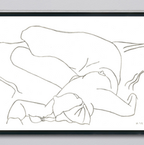An art display.  A line drawing in pencil on paper.  A woman is lain out in a life drawing pose.  Art piece is in a black frame and hangs on a white brick wall.
