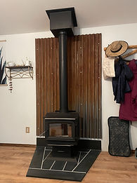 Craftsman workshop with wood beams and custom cabinetry displays