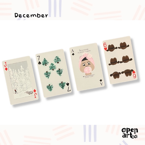 Four deck of card in diagonal with painted artwork on it