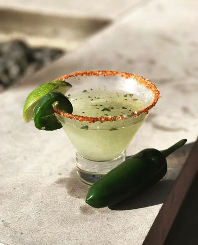 Texas Tini with lime and jalepeno and a tajin salt rim