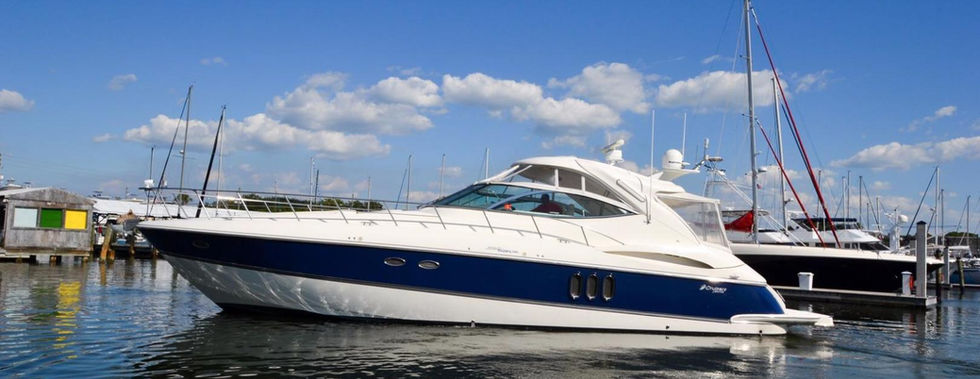 Luxury yacht on the water against a blue sky IRON CITY YACHT harbor view