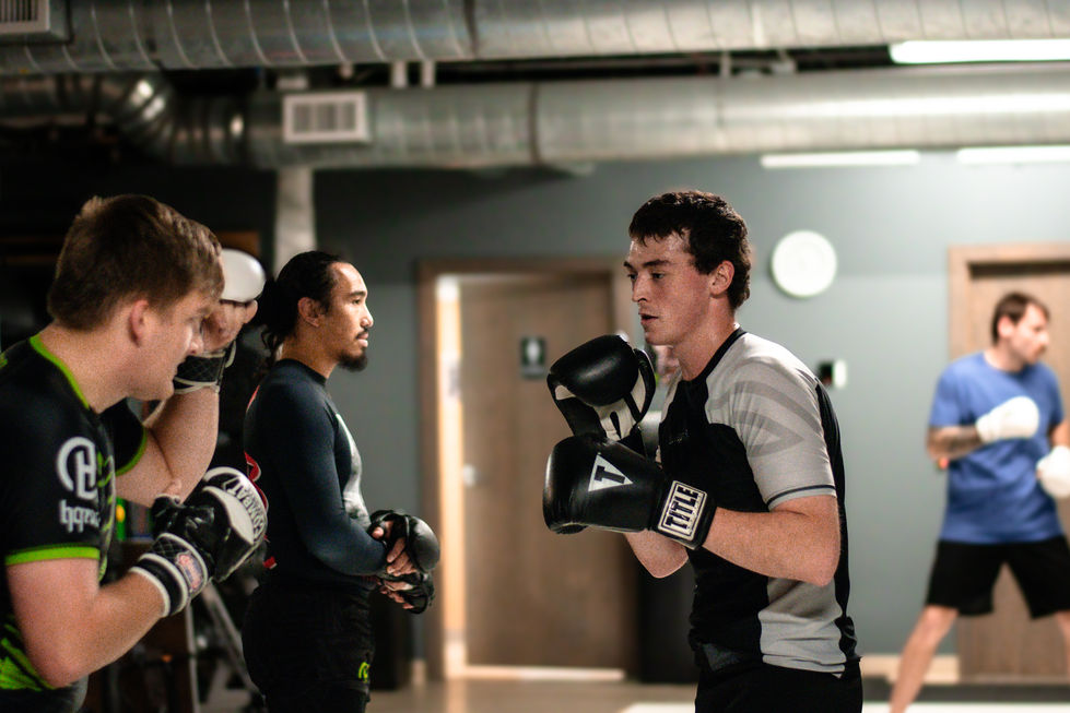 a man wearing a pair of title boxing gloves