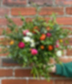 Large luxury bouquet with freshly cut British-grown seasonal flowers in wild, whimsical style