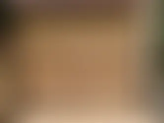 Log home exterior in Alberta during staining and sealing maintenance for UV protection and weather resistance