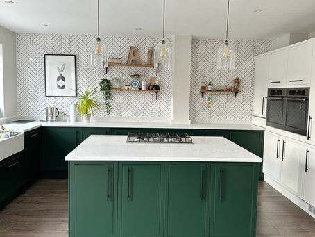 Green kitchen island with white worktops