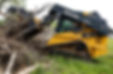 John Deere loader performing tree debris cleanup