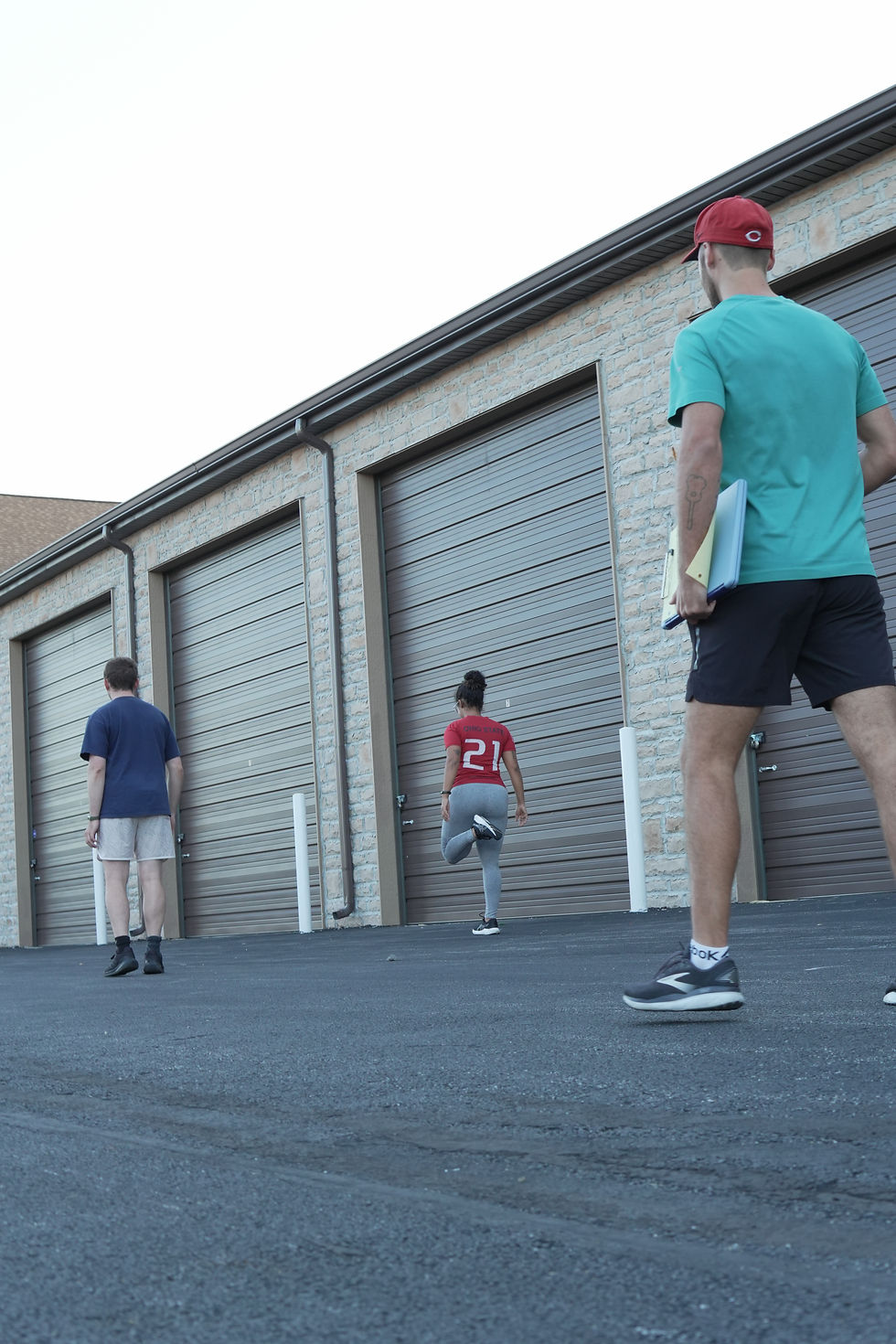 Personal Trainer David coaching clients through a dynamic warm-up