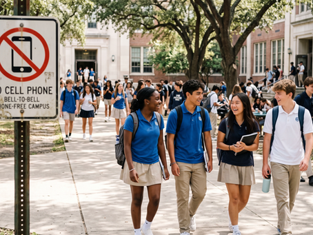 High school students smiling and talking on an outdoor campus path without smartphones.
