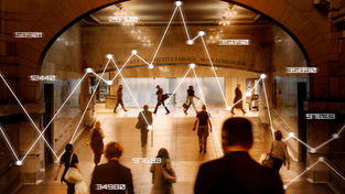 Retail shopper conversion rate analytics showing customer movement and data insights in a busy shopping concourse.