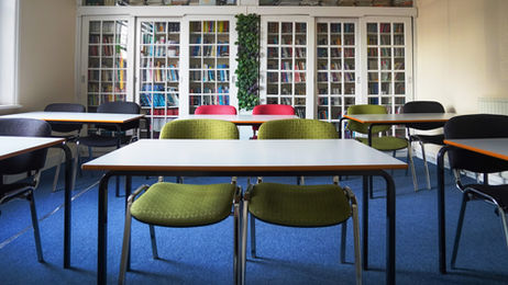 Room 102 meeting room with bookshelf backdrop, seating up to 12 in Tottenham N17