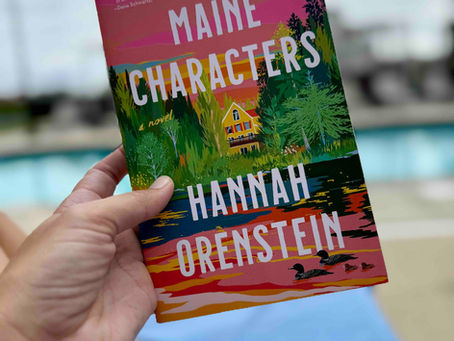 Book held up in front of a pool