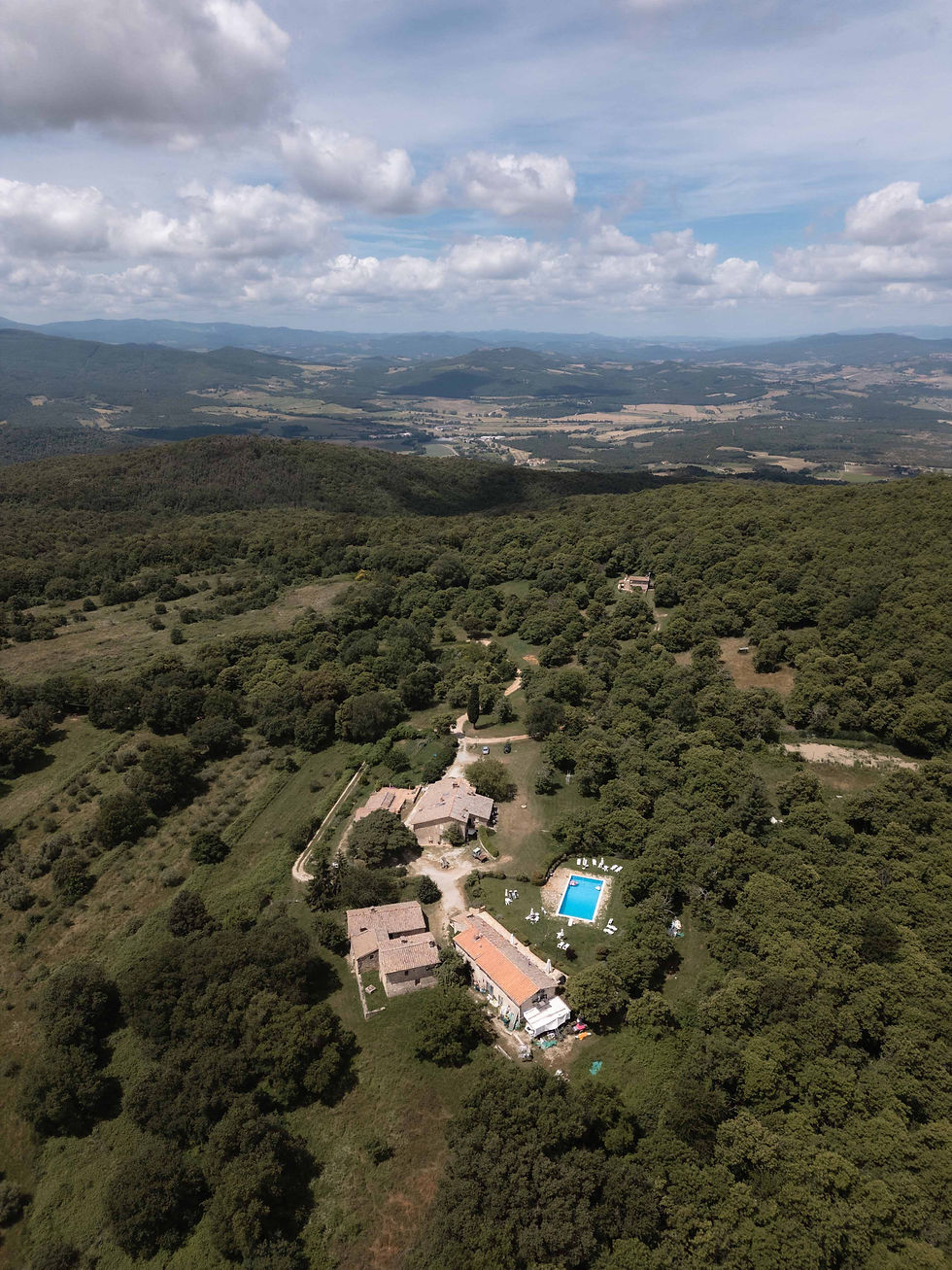 Aerial drone view of Agriturismo Poggio ai Legni in Tuscany — the farmhouse where we stayed during the Castello di Celsa wedding week
