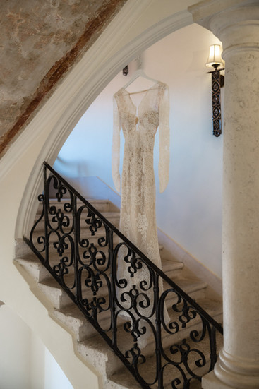 That quiet, anticipation-filled moment before it all begins. Gown by Angela Wedding House.