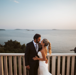 The bride and groom embrace on the balcony of Villa Soline in Dubrovnik, photographed by Bojan Petricevic, a photographer from Dubrovnik