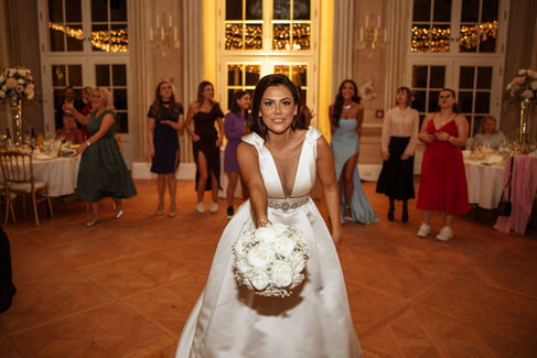 The bride throws the bouquet