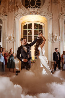 The bride and groom dance their first wedding dance in the ceremonial hall of the Laxenburg Conference Center