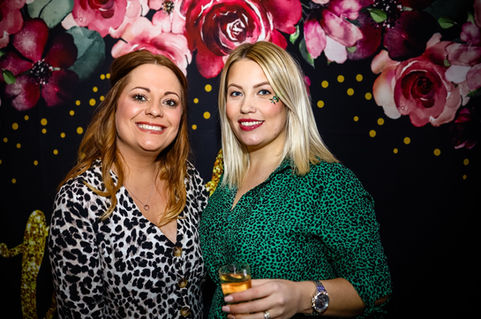 Eyes2Me Photography: Private Social Events. Two female friends having a drink, looking at the camera during a birthday party event.