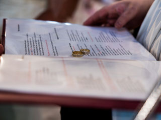 Vicar blessing the wedding rings at Gelligaer Church, Caerphilly.