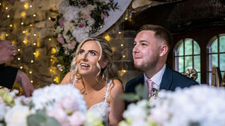 Wedding Ceremony Photography at Pencoed House, Cardiff. Bride and groom looking at the registration officer after the ceremony.