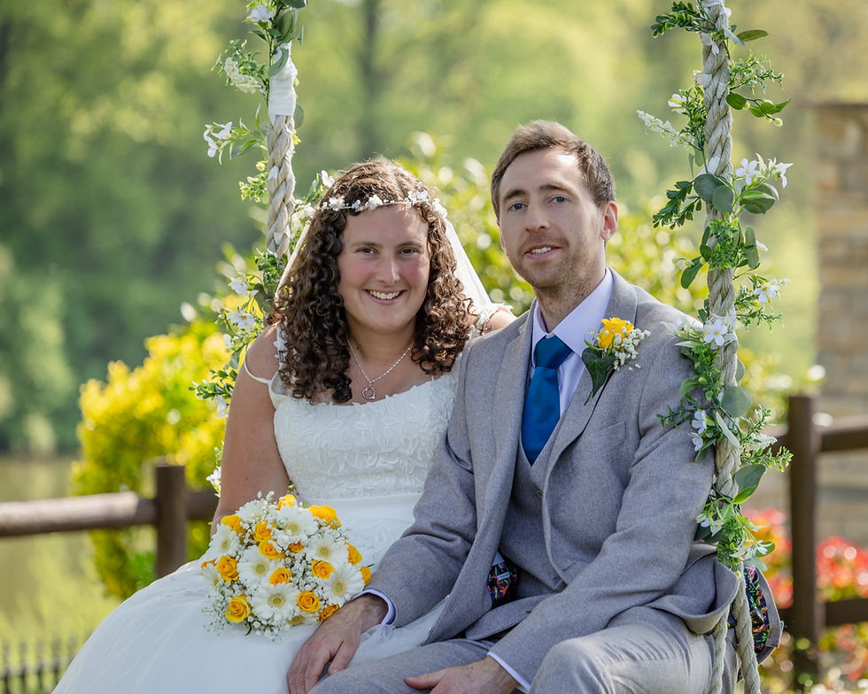 Bride and Groom on a swing during their wedding day in Canada lodge and lake, Cardiff.