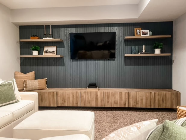 Basement redesign with wall tv and storage