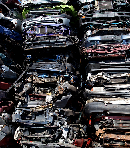 crushed automobiles stacked on top of one another